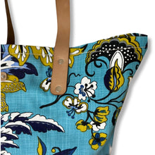Load image into Gallery viewer, Binny Bag material tote/beach bag with florals and bright blue background - closeup of corner