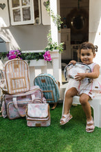 Load image into Gallery viewer, Little girl with all her Thandana laminated fabric bags.