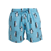 Load image into Gallery viewer, The Breazies Kids Swim Shorts - Penguins in baby blue feature cartoon penguins, some with drinks. Made from recycled polyester, these trunks offer an elastic waist with drawstring and side pockets for convenience.