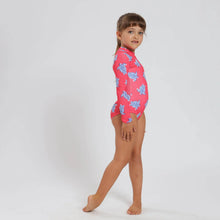 Load image into Gallery viewer, Breazies girls long sleeve swimsuit with turtles on a coral background - side view shown on young girl