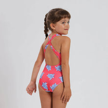 Load image into Gallery viewer, Breazies Girls one piece swimsuit with blue turtles on a coral background - shown on girl looking over her shoulder