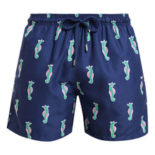Load image into Gallery viewer, Breazies men swim shorts with green and pink sea horses on a navy background - front view