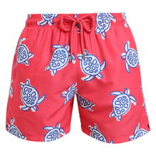 Load image into Gallery viewer, Breazies adult swim shorts with navy turtles on a coral red background - front view