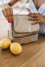 Load image into Gallery viewer, Lady holding her Thandana insualted cooler bag in a thermal double compartment design. perfect for work lunches.