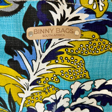 Load image into Gallery viewer, Binny Bag material tote/beach bag with florals and bright blue background - logo