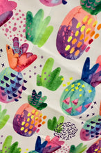 Load image into Gallery viewer, The Bobums Beach Towel - Patterned Pines is a quick-drying microfibre towel featuring vibrant pineapples and green-pink cacti in an abstract design. Perfect for those who love bold, playful styles, it serves as an ideal double-sided towel.