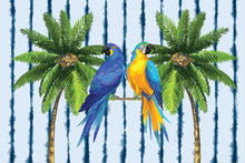 Load image into Gallery viewer, Two vibrant parrots, one blue and one blue-yellow, sit on a branch among lush palms, evoking a tropical beach vibe against the sapphire and white striped backdrop of Natural Selection's "Sarong with Matching Wet Bag - Sapphire Stream.