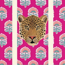 Load image into Gallery viewer, The Beach Bag - Amy Taj by Natural Selection features a leopard's head on a vibrant pink backdrop with teal and pink floral patterns. Beige vertical stripes are shown for the handles, all set on durable material with waterproof lining.