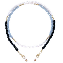 Load image into Gallery viewer, The Sichri Eyewear Strap - Crystal Joy Black features stylish small beads in white, blue, and black segments with crystal shimmer accents. Gold accents and lobster clasp clips at both ends offer elegance and easy attachment.
