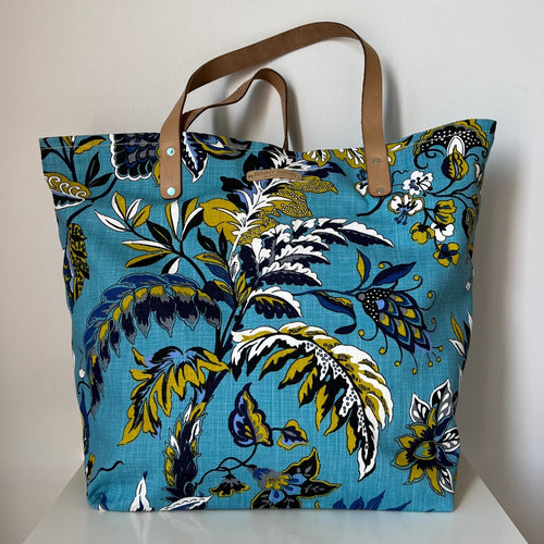 Binny Bag material tote/beach bag with florals and bright blue background