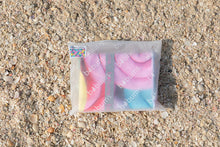 Load image into Gallery viewer, Folded Bobums UAE Microfibre beach towel with Sorbet Snails design in recyclable plastic bag on beach