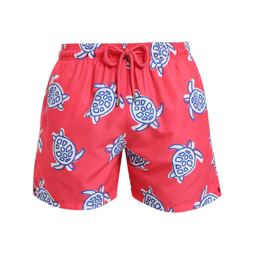 Breazies kids swim shorts with turtles on a coral red background - front view