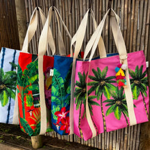 Load image into Gallery viewer, Four Natural Selection beach bags hanging  - colourful totes crafted from poly canvas, showcasing beige handles and a vibrant design . They feature waterproof lining and a tassel charm on one handle.
