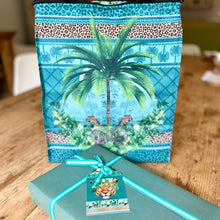 Load image into Gallery viewer, Example of tanzanite cooler bag gift with matching gift tag and ribbon.
