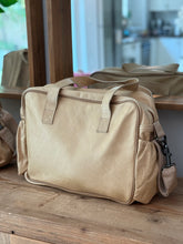 Load image into Gallery viewer, View of back of Thandana baby nappy diaper bag. Made from soft Hazelnut leather.
