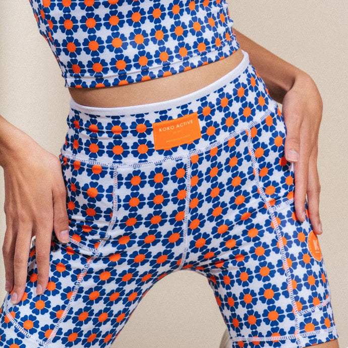 A person wears a vibrant Koko Active set featuring 