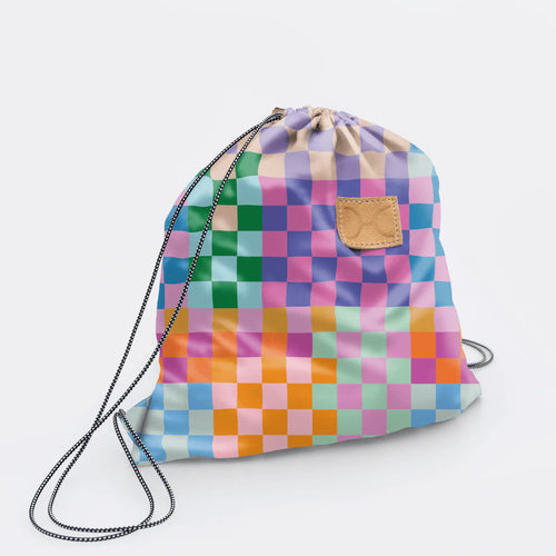 Colorful Thandana checkered water-resistant drawstring bag on a light gray background.