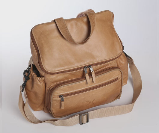 Stylish and practical Thandana leather nappy backpack with changing mat, bottle holders, and genuine leather trims, made in South Africa.