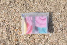 Load image into Gallery viewer, Folded Bobums UAE Microfibre beach towel with Sorbet Snails design in recyclable plastic bag on beach
