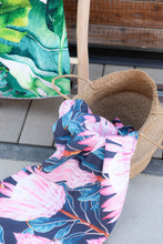 Load image into Gallery viewer, Bobums UAE Microfibre beach towel with Pink Protea design in basket
