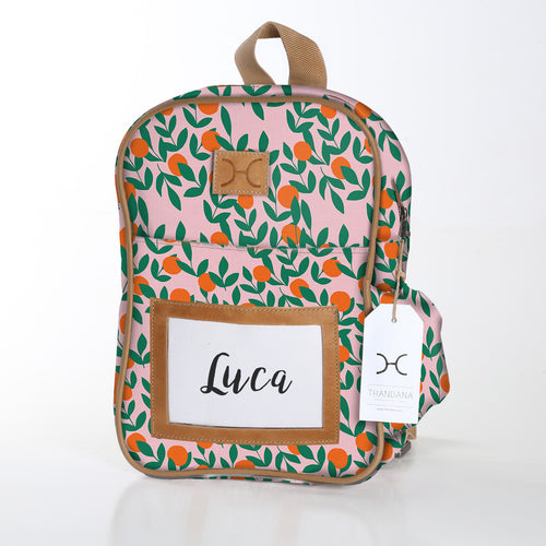 Stylish and durable Thandana kids backpack, fits A4 books, PVC laminated waterproof fabric, leather details, and side bottle pocket.
