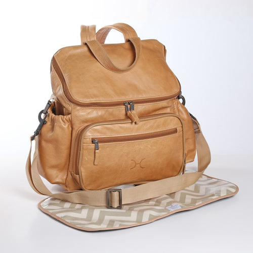 Thandana Hazelnut Leather Baby Nappy Backpack in Dubai with multiple pockets, adjustable straps, and water-resistant lining for parents on the go.