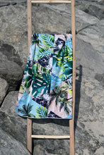 Load image into Gallery viewer, Bobums UAE Microfibre beach towel with Geo Palm design on ladder
