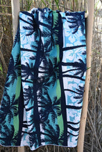 Load image into Gallery viewer, Bobums UAE Microfibre beach towel with Blue Palms Kids design on ladder in front of grass
